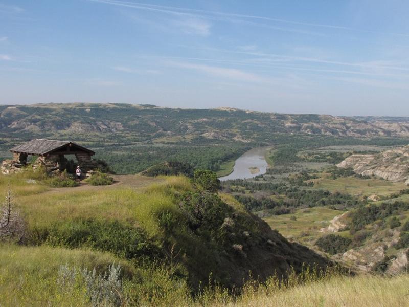 Little Missouri River flowing in a small floodplain between bluffs on either side